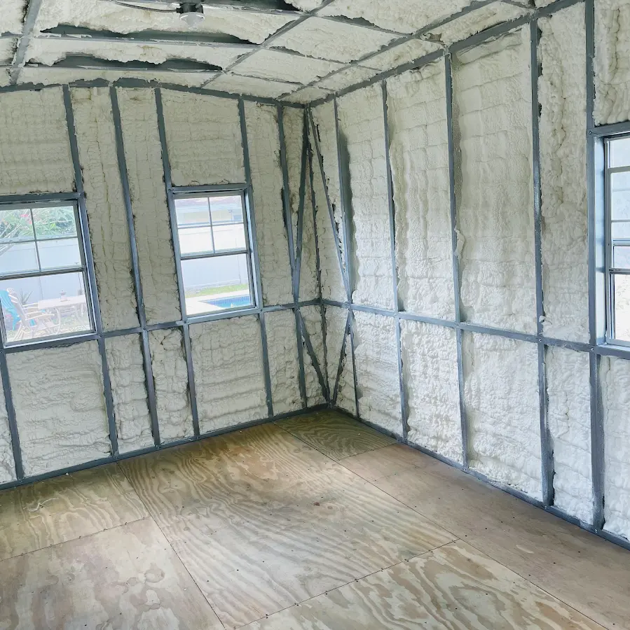 Closed-cell spray foam insulation applied to wall cavities in a residential project in Destin